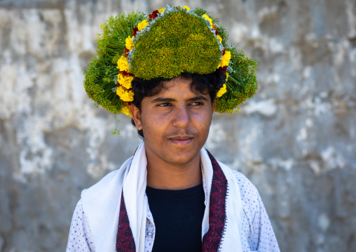 Portrait of a flower man wearing a floral crown on the head, Jizan province, Addayer, Saudi Arabia