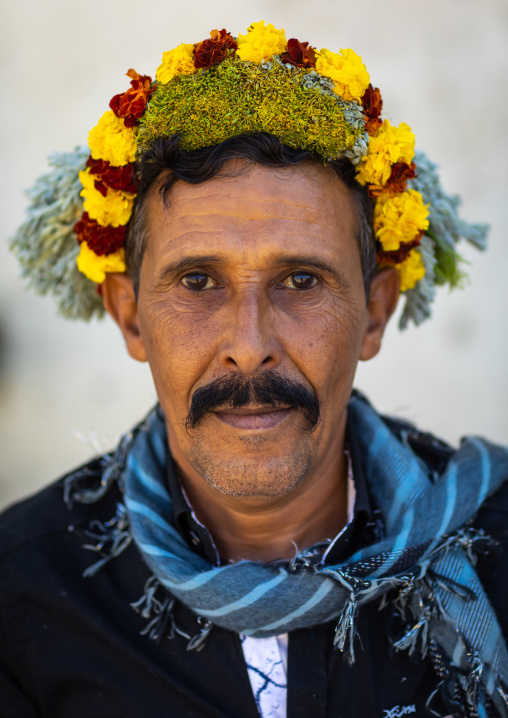 Portrait of a flower man wearing a floral crown on the head, Jizan province, Addayer, Saudi Arabia