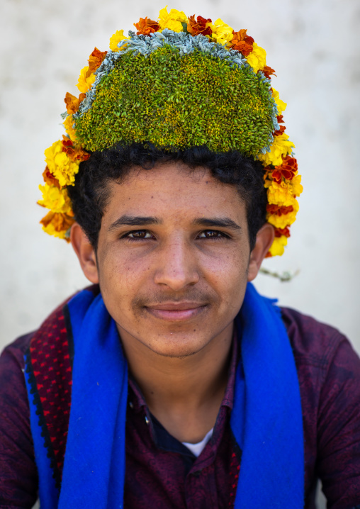 Portrait of a flower man wearing a floral crown on the head, Jizan province, Addayer, Saudi Arabia