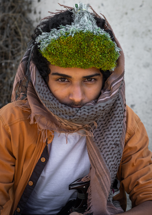 Portrait of a flower man wearing a floral crown on the head, Jizan province, Addayer, Saudi Arabia