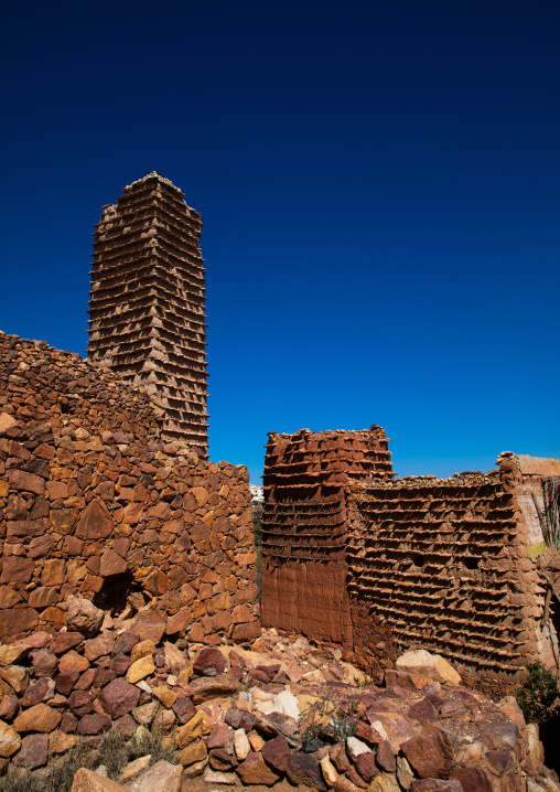 Red stone and mud houses with slates in a village, Asir province, Sarat Abidah, Saudi Arabia