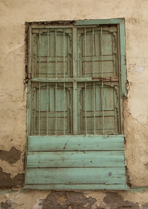 Green window of an old house used as a free dormitory in the past, Mecca province, Jeddah, Saudi Arabia