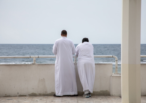 Saudi men looking at the sea, Mecca province, Jeddah, Saudi Arabia