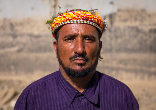 Portrait of a flower man wearing a floral crown on the head, Jizan Province, Addayer, Saudi Arabia