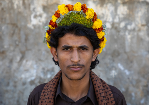 Portrait of a flower man wearing a floral crown on the head, Jizan Province, Addayer, Saudi Arabia
