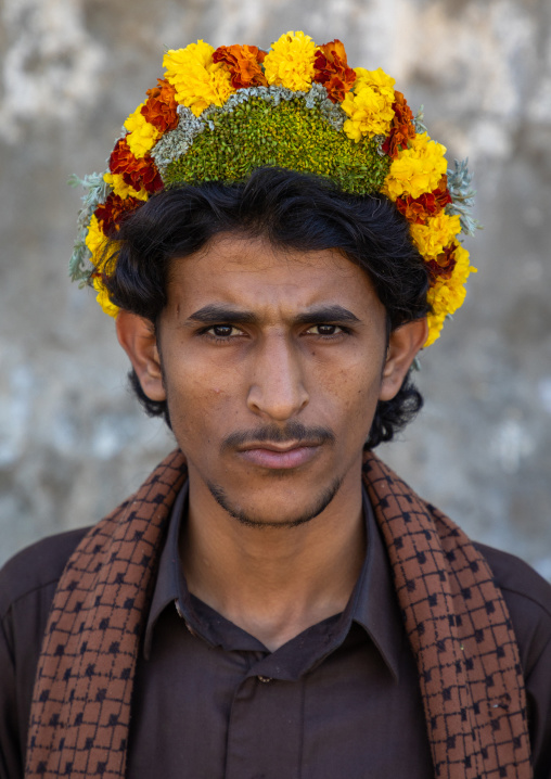 Portrait of a flower man wearing a floral crown on the head, Jizan Province, Addayer, Saudi Arabia