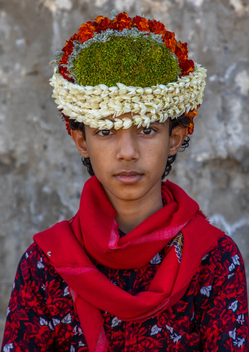 Portrait of a flower boy wearing a floral crown on the head, Jizan Province, Addayer, Saudi Arabia