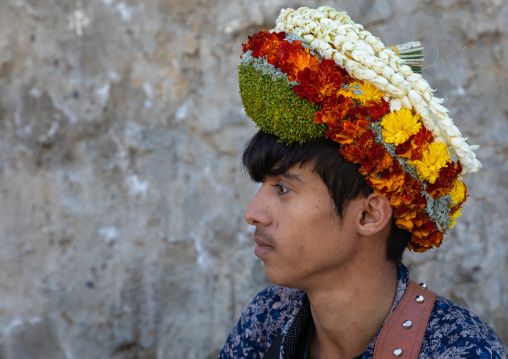 Portrait of a flower young man wearing a floral crown on the head, Jizan Province, Addayer, Saudi Arabia