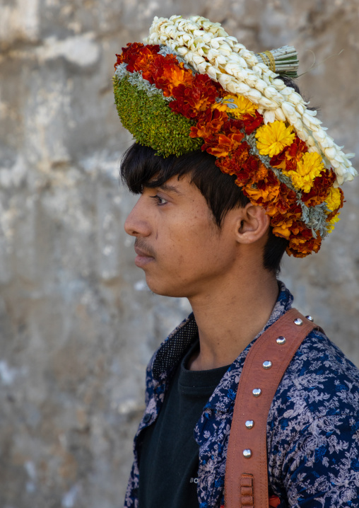 Portrait of a flower young man wearing a floral crown on the head, Jizan Province, Addayer, Saudi Arabia