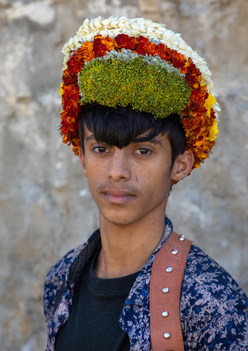Portrait of a flower young man wearing a floral crown on the head, Jizan Province, Addayer, Saudi Arabia