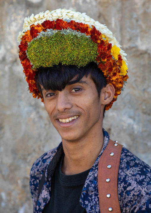 Portrait of a flower young man wearing a floral crown on the head, Jizan Province, Addayer, Saudi Arabia