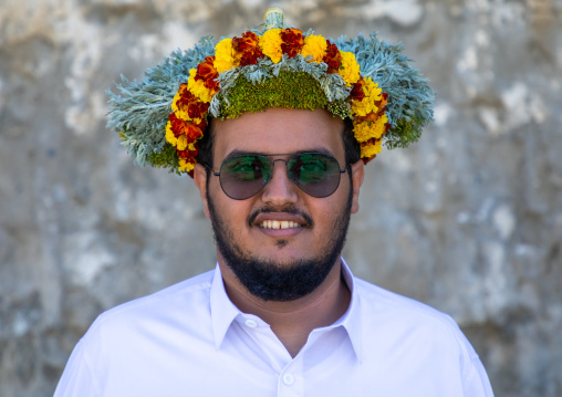 Portrait of a flower man wearing a floral crown on the head, Jizan Province, Addayer, Saudi Arabia