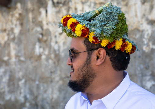 Portrait of a flower man wearing a floral crown on the head, Jizan Province, Addayer, Saudi Arabia