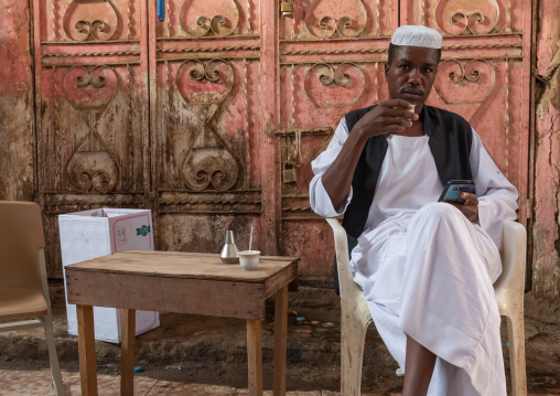 Sudanese man drinking coffee in a market, Jizan Province, Sabya, Saudi Arabia