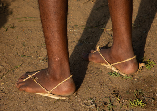 Old saudi man wearing traditional shoes made of palm leaves, Jizan Province, Mahalah, Saudi Arabia