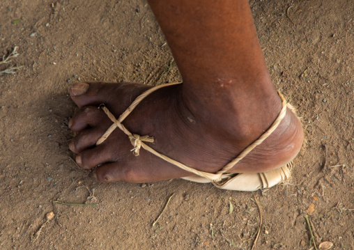 Old saudi man wearing traditional shoes made of palm leaves, Jizan Province, Mahalah, Saudi Arabia