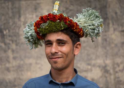 Portrait of a flower man wearing a floral crown on the head, Jizan Province, Addayer, Saudi Arabia