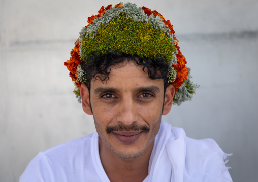 Portrait of a flower man wearing a floral crown on the head, Jizan Province, Addayer, Saudi Arabia