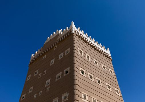 Traditional old mud house against blue sky, Najran Province, Najran, Saudi Arabia