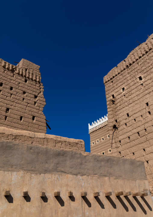 Traditional old mud house against blue sky, Najran Province, Najran, Saudi Arabia