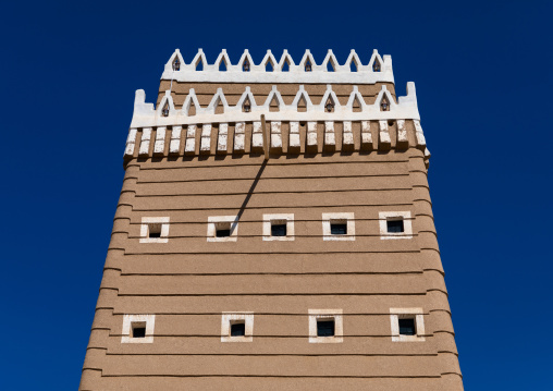 Traditional old mud house against blue sky, Najran Province, Najran, Saudi Arabia