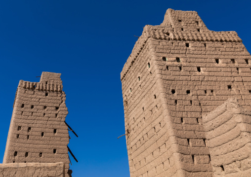 Traditional old mud house against blue sky, Najran Province, Najran, Saudi Arabia