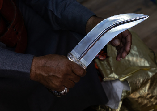 Saudi man holding a janbiya dagger blade, Najran Province, Najran, Saudi Arabia