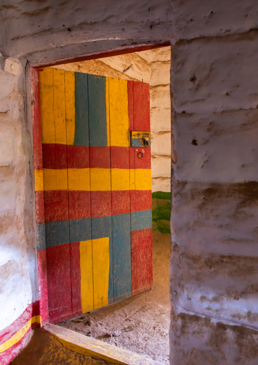 Colorful wooden door of an abandonned asiri house, Asir province, Sarat Abidah, Saudi Arabia