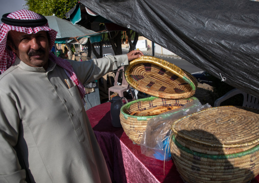 Saudi man buying bread in the women market, Asir province, Abha, Saudi Arabia