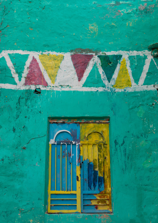Painted window on an old house, Asir province, Rijal Alma, Saudi Arabia