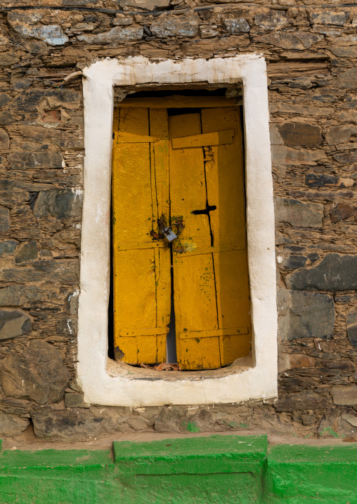 Yellow door in heritage village, Asir province, Rijal Alma, Saudi Arabia