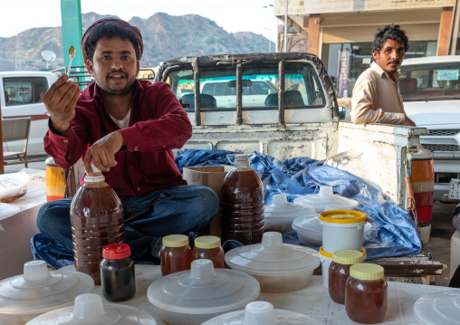 Saudi man selling honey and honeycombs on a market, Asir province, Al Habeel, Saudi Arabia