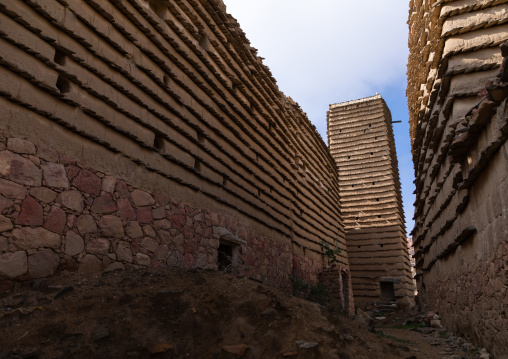 Stone and mud houses and watchtower with slates in al Khalaf village, Asir province, Sarat Abidah, Saudi Arabia