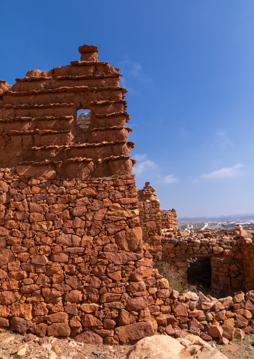 Red stone and mud houses with slates in a village, Asir province, Sarat Abidah, Saudi Arabia