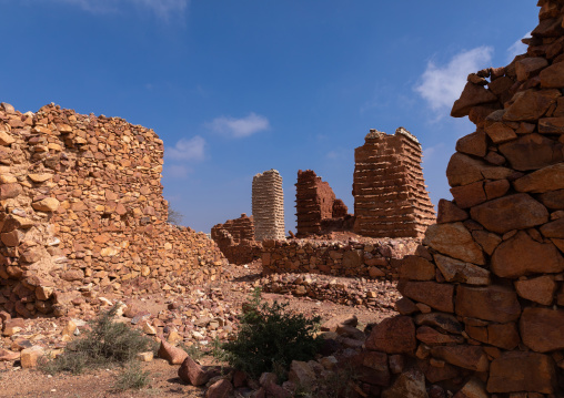 Red stone and mud houses and watchtower with slates in a village, Asir province, Sarat Abidah, Saudi Arabia