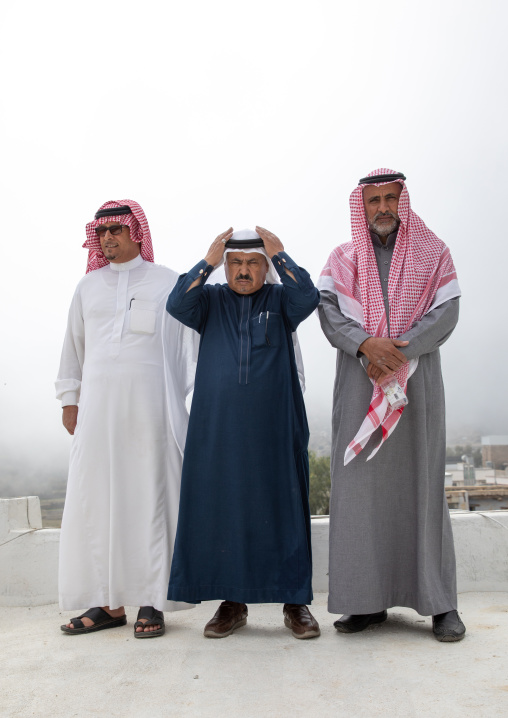 Portrait of three sausi men in traditional clothing, Asir province, Tanomah, Saudi Arabia