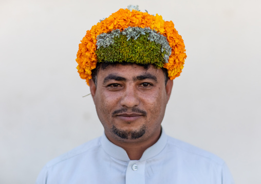 Portrait of a flower man wearing a floral crown on the head, Jizan Province, Addayer, Saudi Arabia