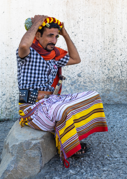 Portrait of a flower man making a floral crown on his head, Jizan Province, Addayer, Saudi Arabia