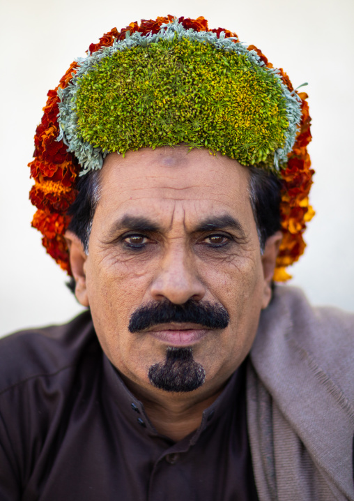 Portrait of a flower man wearing a floral crown on the head, Jizan Province, Addayer, Saudi Arabia