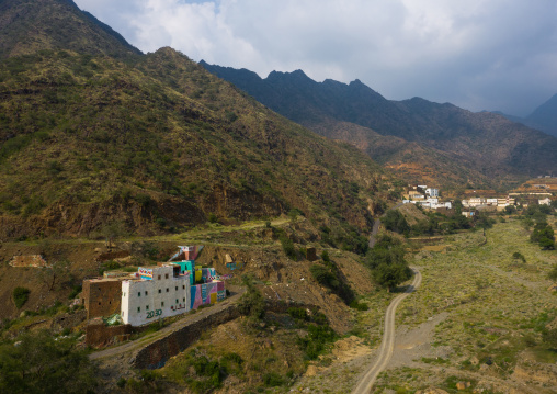 Aerial view of an old traditional house with 2030 logo on the facade, Asir province, Rijal Alma, Saudi Arabia