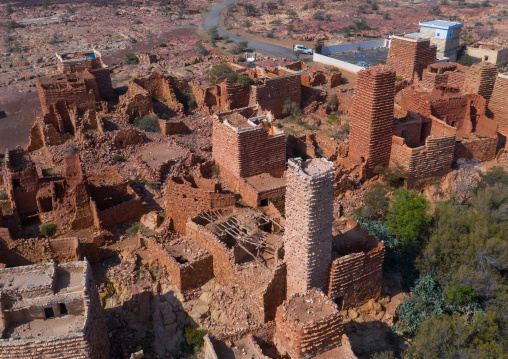 Aerial view of red stone and mud houses with slates in a village, Asir province, Sarat Abidah, Saudi Arabia