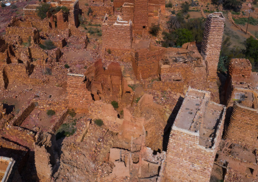 Aerial view of red stone and mud houses with slates in a village, Asir province, Sarat Abidah, Saudi Arabia