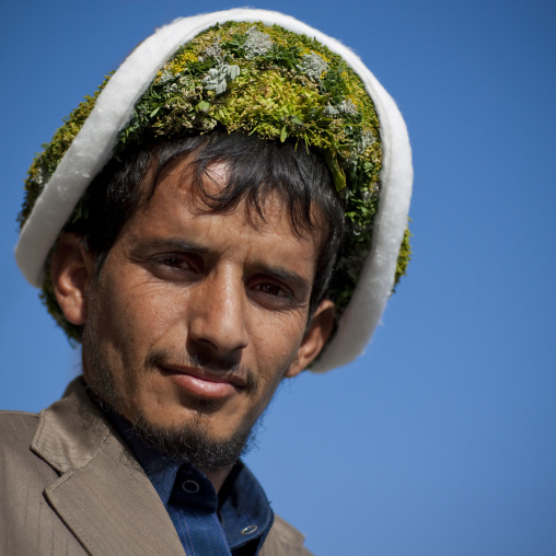Portrait of a flower man wearing a floral crown on the head, Jizan province, Addayer, Saudi Arabia