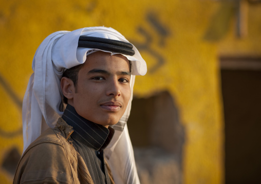 Portrait of a saudi teenager wearing a keffieh, Najran Province, Najran, Saudi Arabia