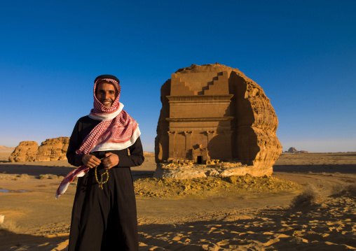 Saudi Tourist In Front Of Nabatean Tomb In Madain Saleh Archaeologic Site, Al Madinah Province, Alula, Saudi Arabia