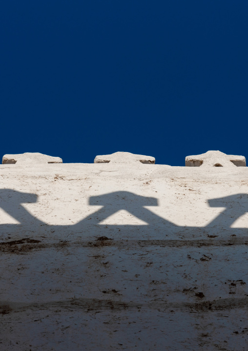 Traditional mud-bricks house wall with crenellations, Najran Province, Najran, Saudi Arabia