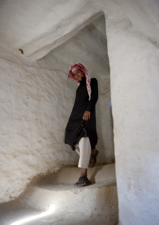 Portrait of a saudi man wearing a keffieh in stairs, Najran Province, Najran, Saudi Arabia