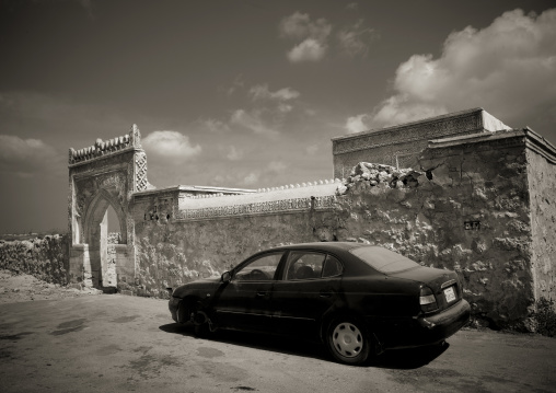 Car parked in front of an old ottoman gate, Red Sea, Farasan, Saudi Arabia