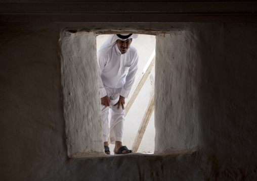 Saudi man entering the Turkish fort, Red Sea, Farasan, Saudi Arabia