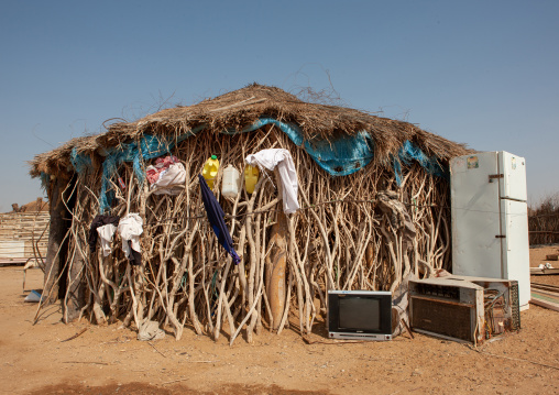 Refrigerator in front of a traditional tihama hut, Jizan Region, Jizan, Saudi Arabia